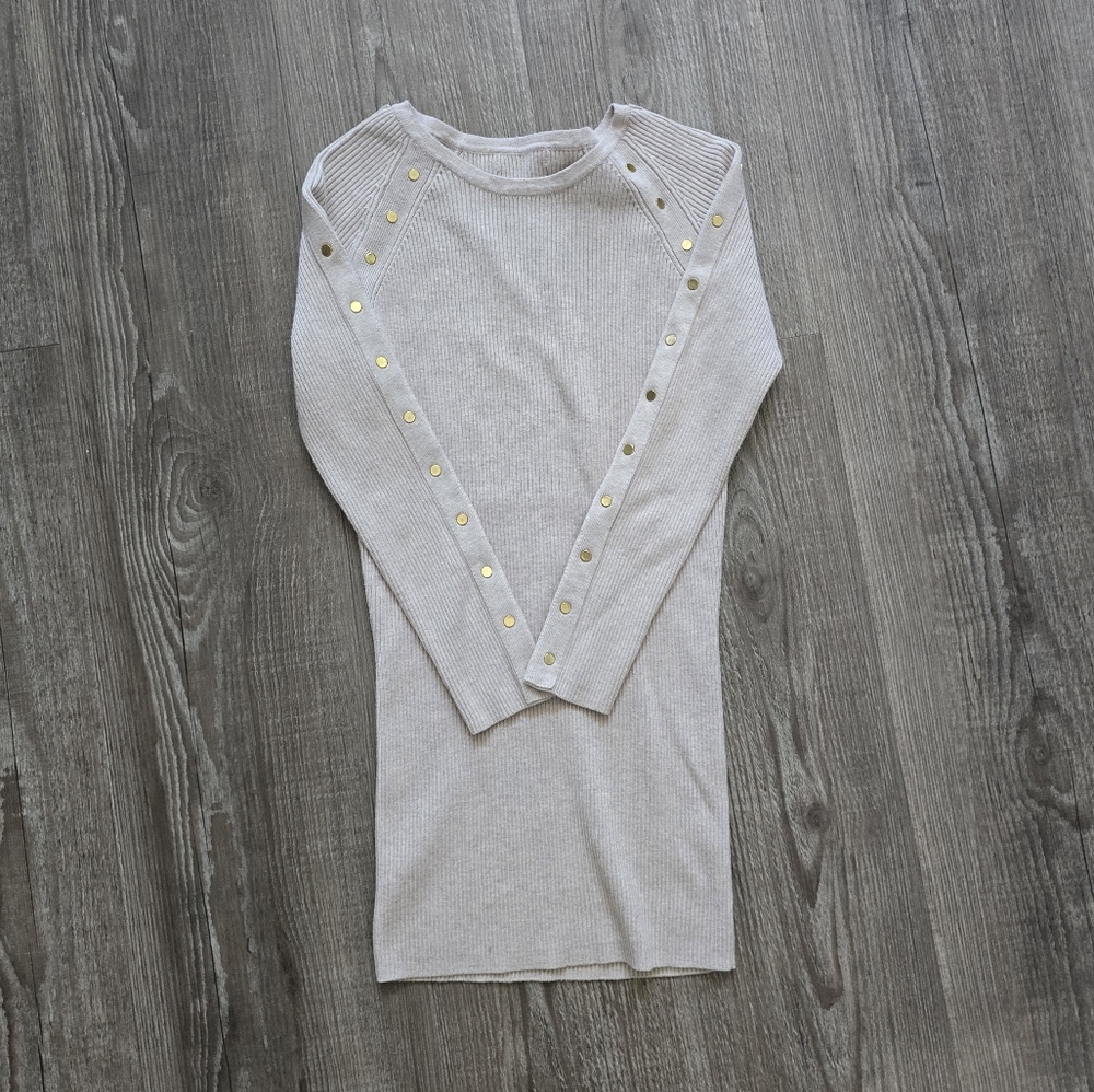 Tan ribbed slim fit sweater with gold decorative rivits. size small